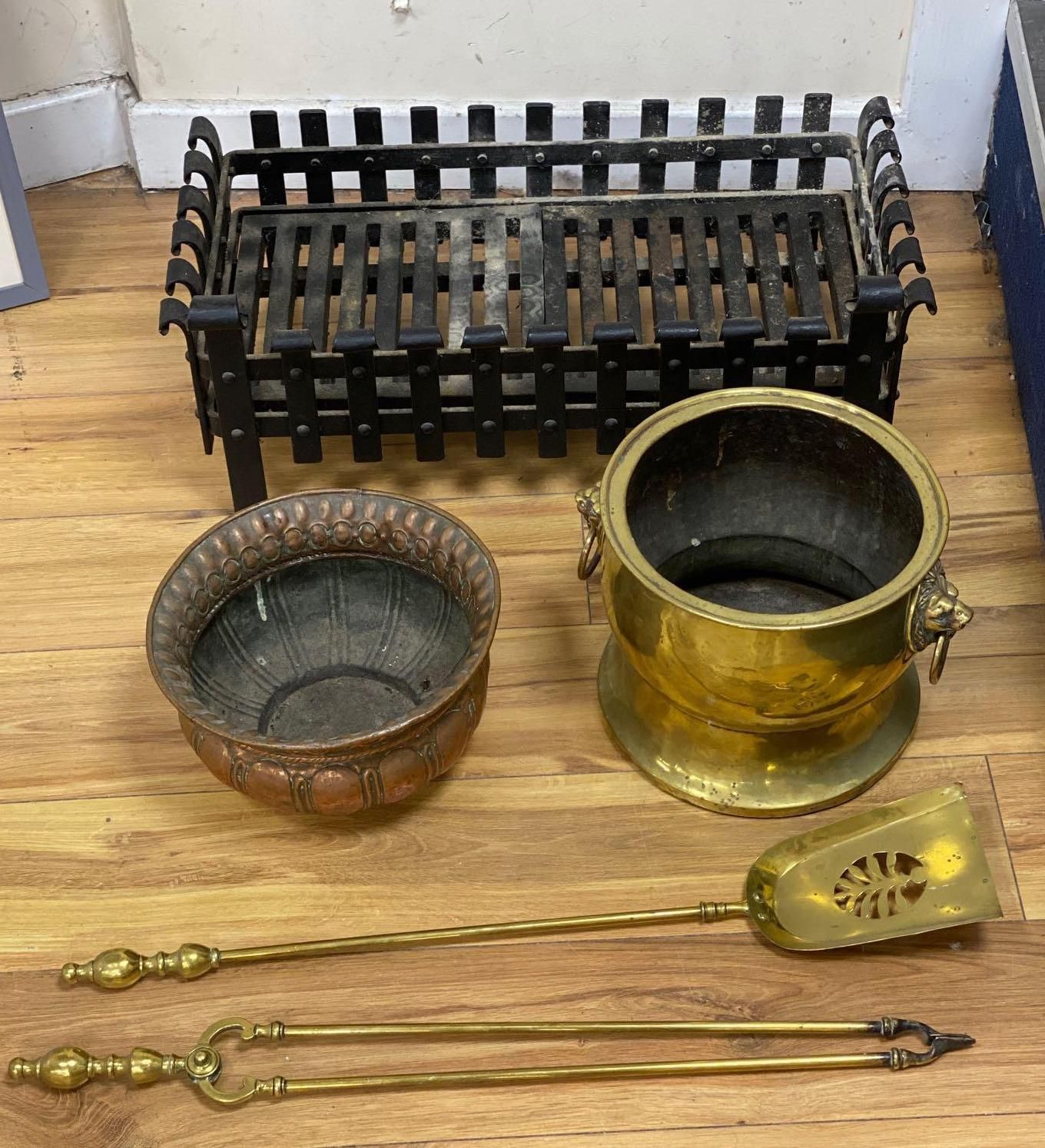 A wrought iron fire grate, two coal bowls and a pair of fire brasses